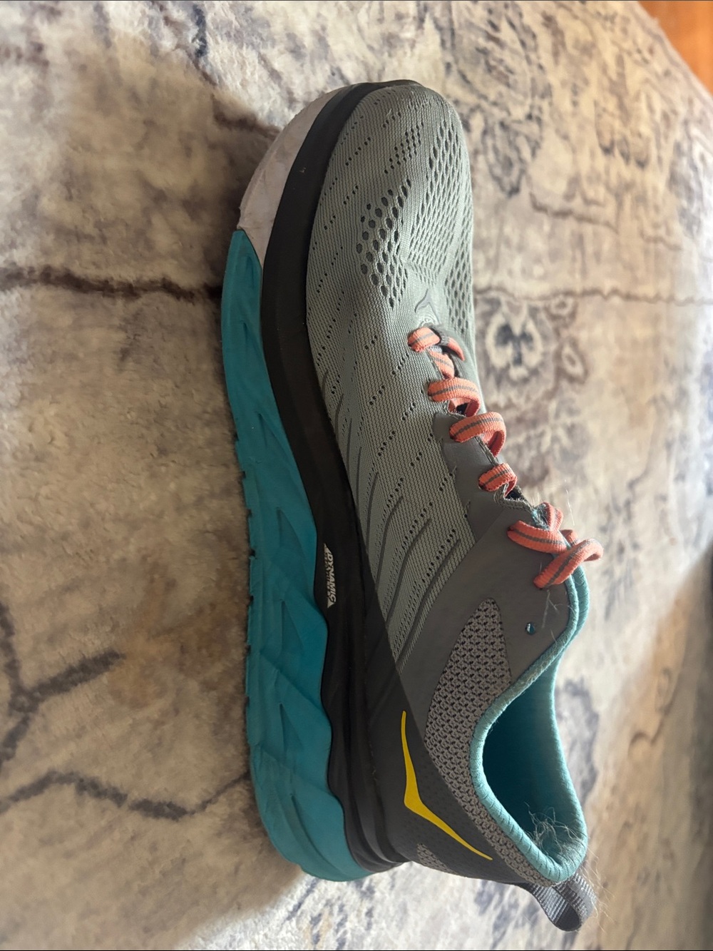 Hoka Women’s Grey Running Shoe with Teal Midsole and Coral Laces